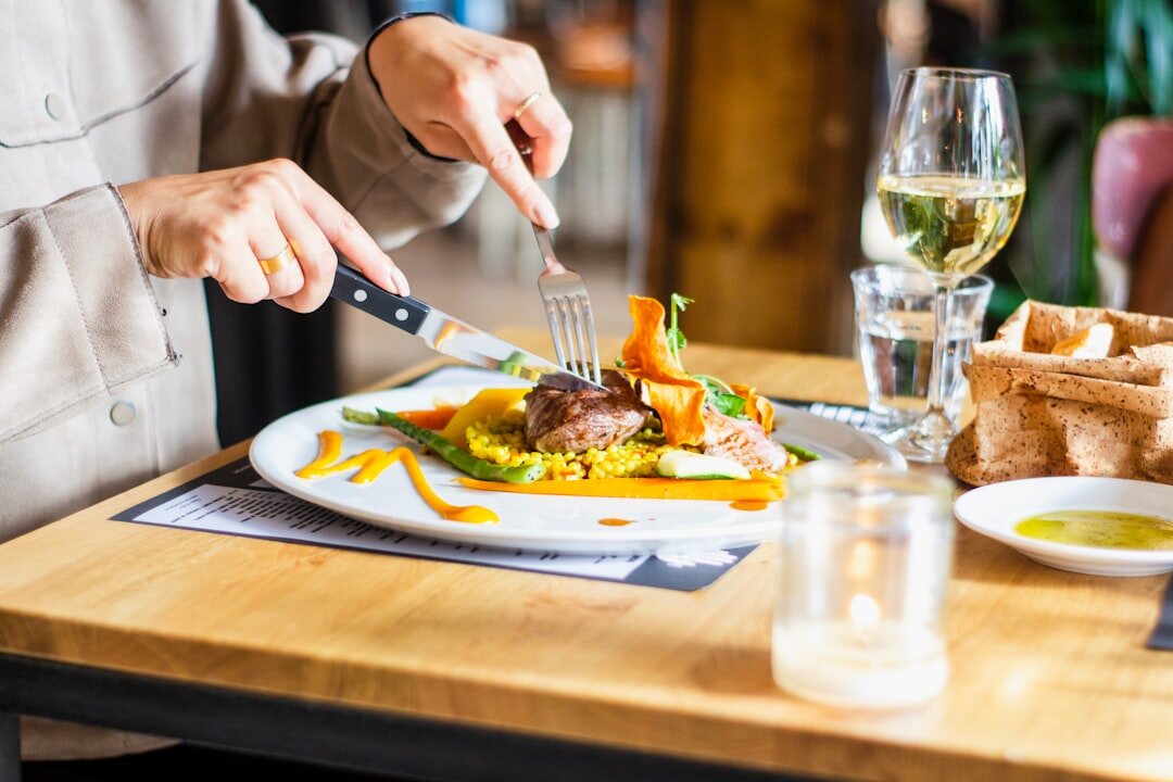 Chef plating food in a Chilean restaurant kitchen