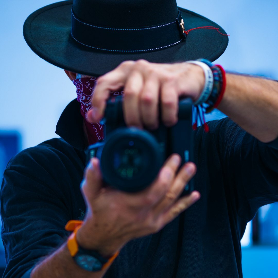 Portrait of a Chilean documentary photographer holding a camera