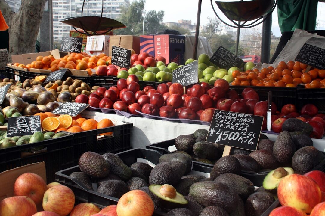 Vendor arranging fruit at a traditional market in Santiago, Chile