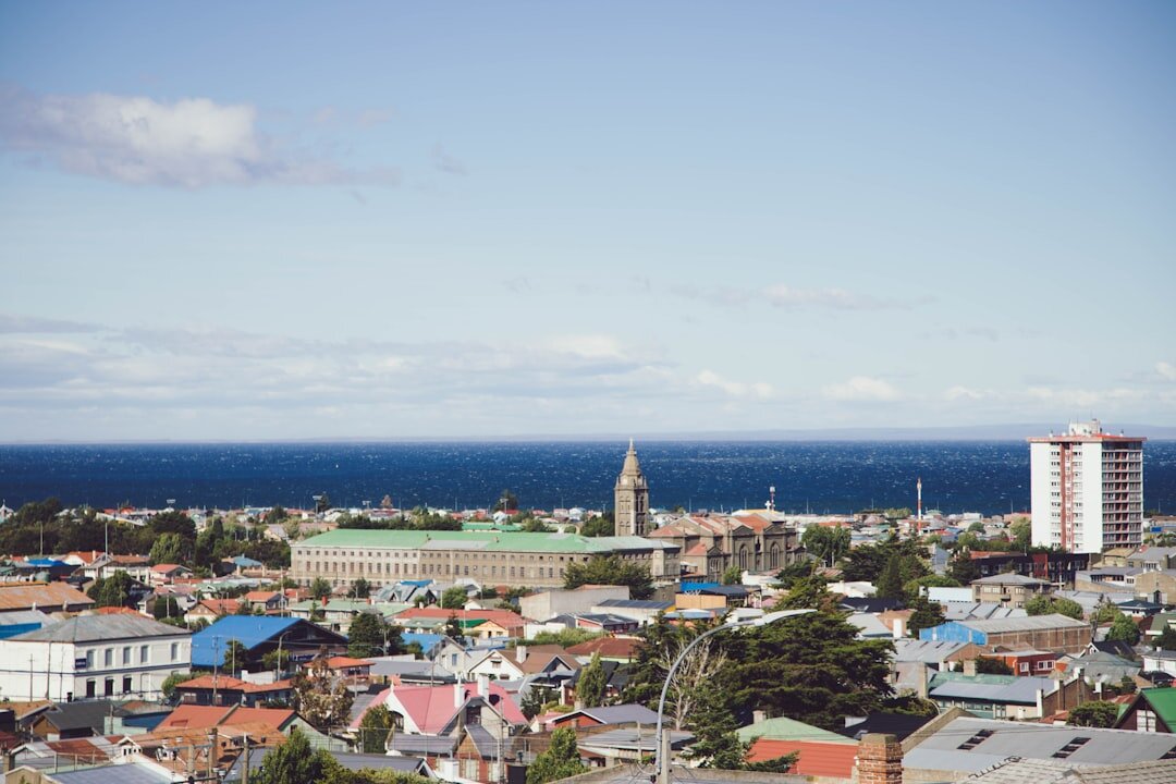 Quiet street with colorful metal roofed houses in Punta Arenas, Chile